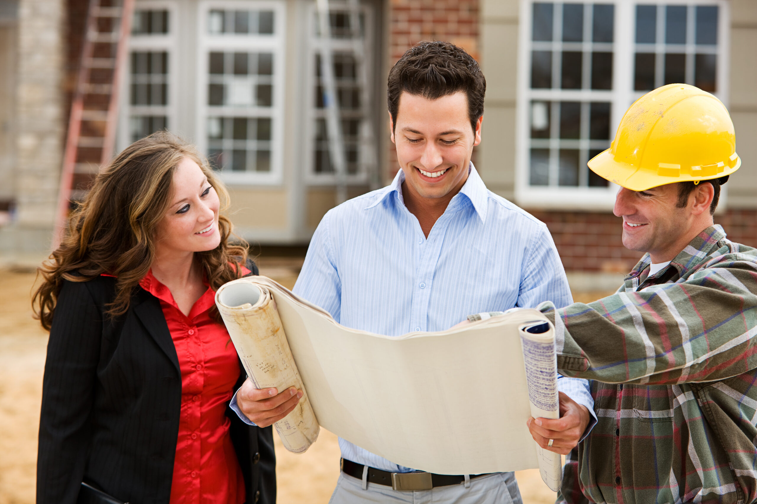Couple reviewing plans for self-build house