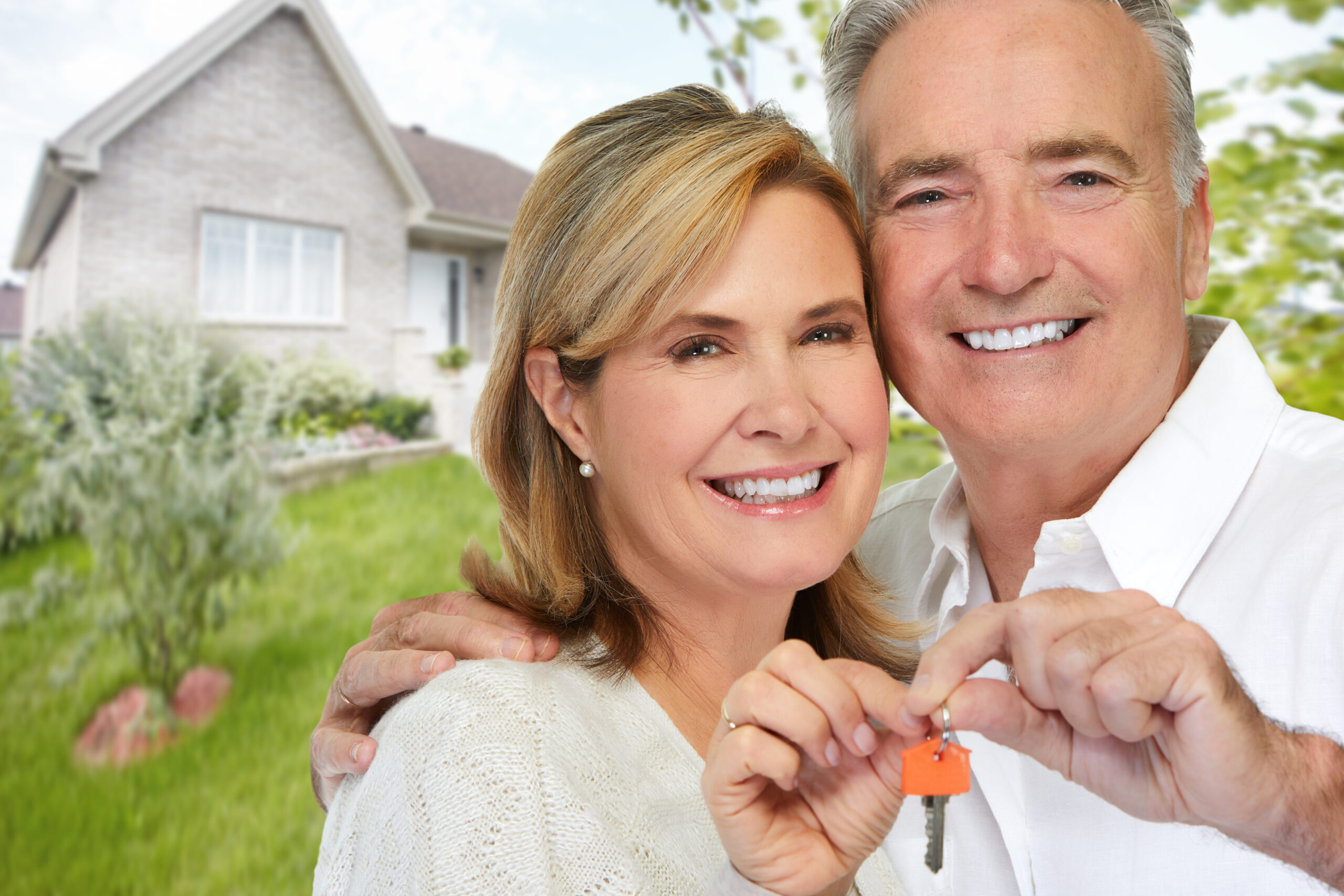 Senior couple with house key