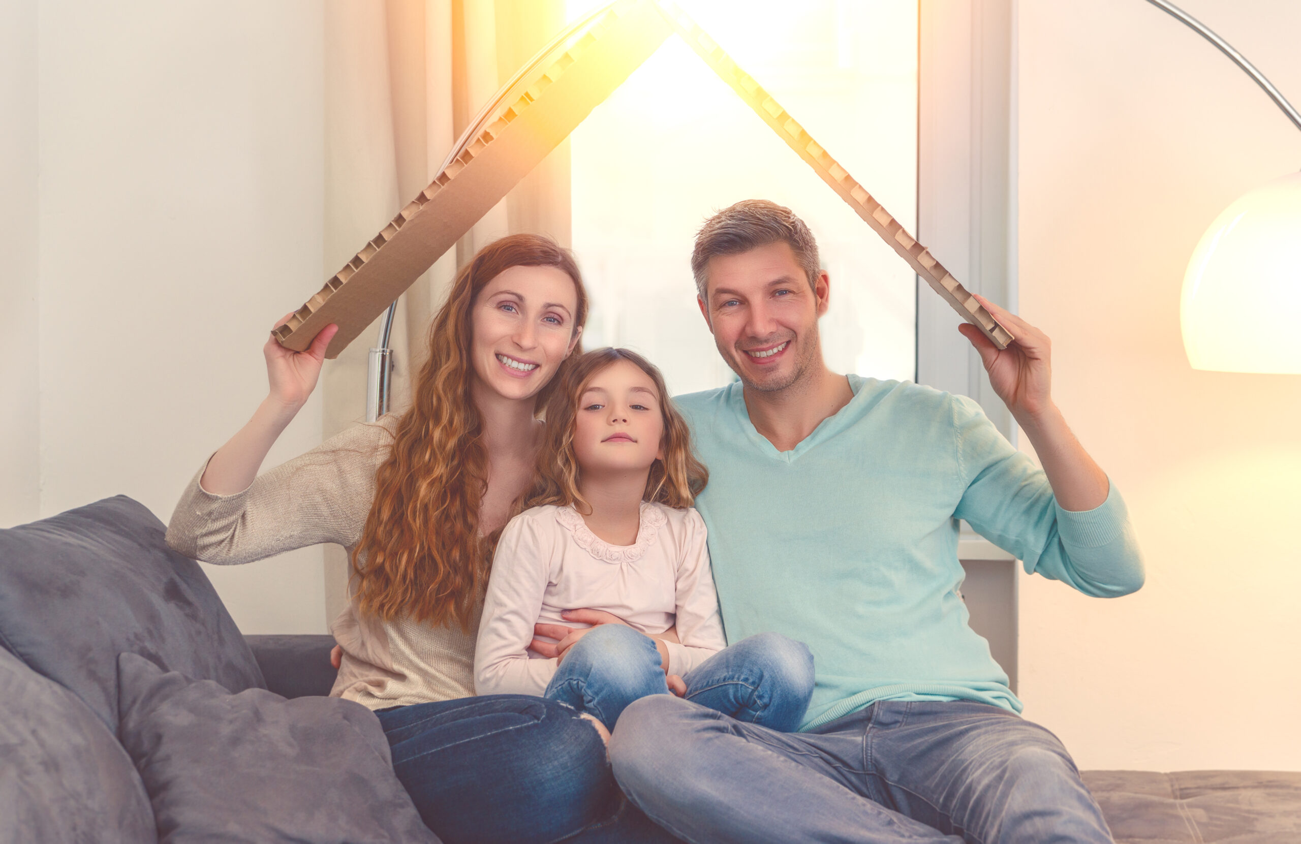 Family in their new house planning with daughter