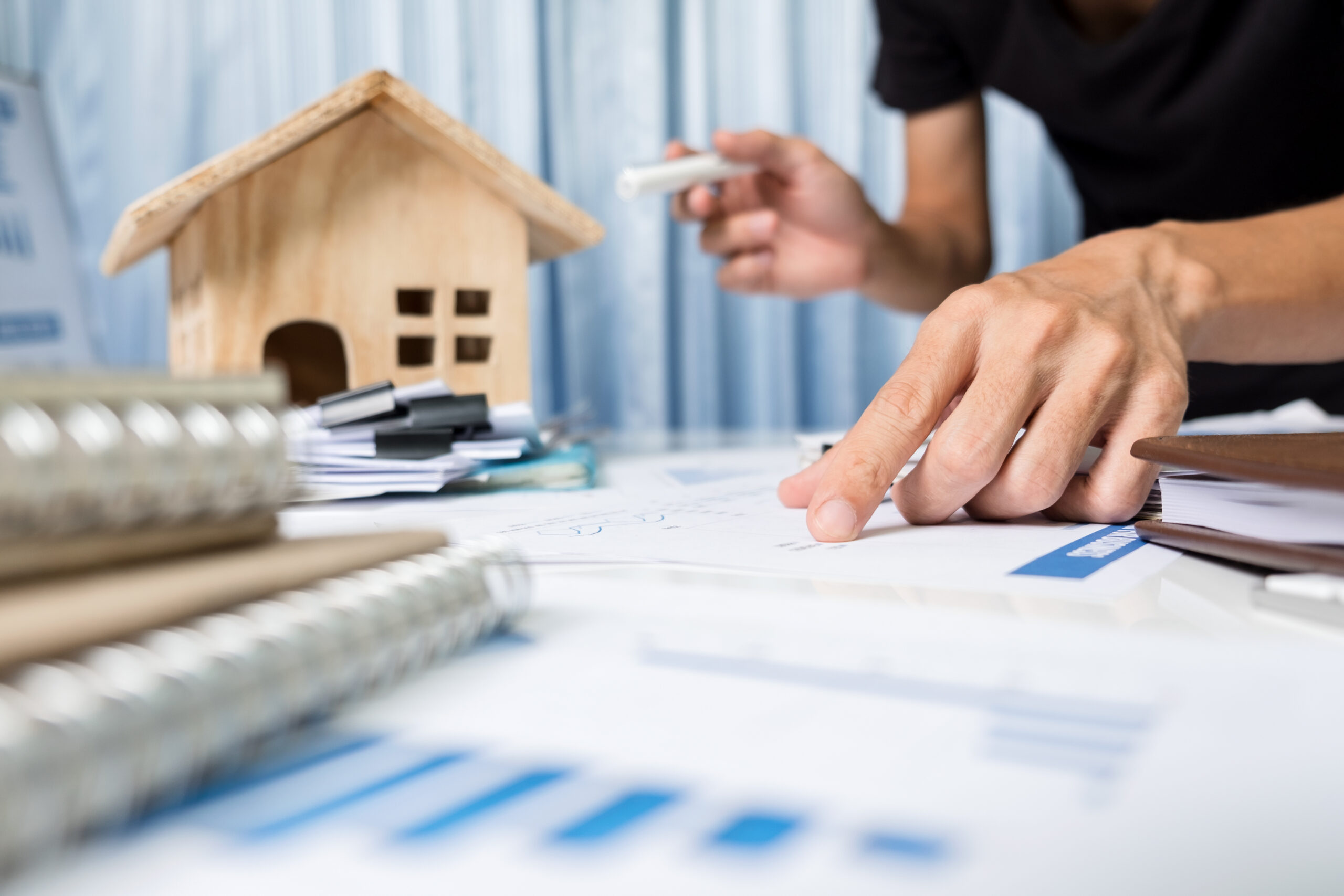Manager working in the office, property for sale concept