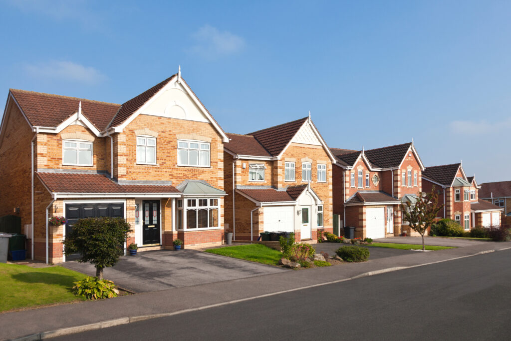 New English street view of modern detached houses