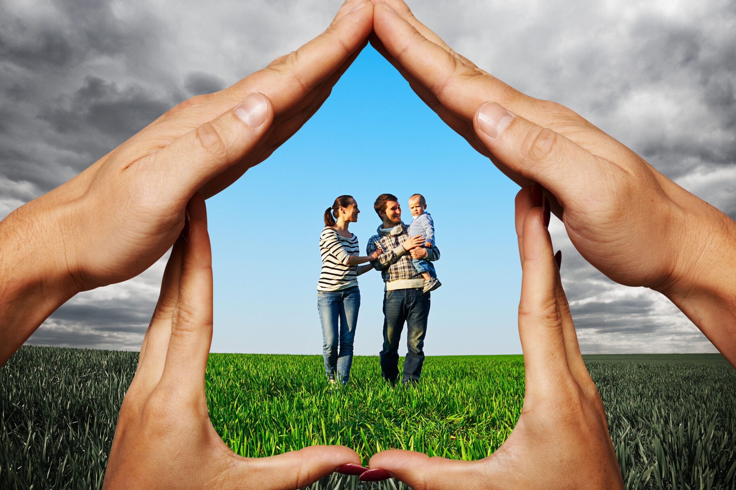 House made of hands protecting young family at the field